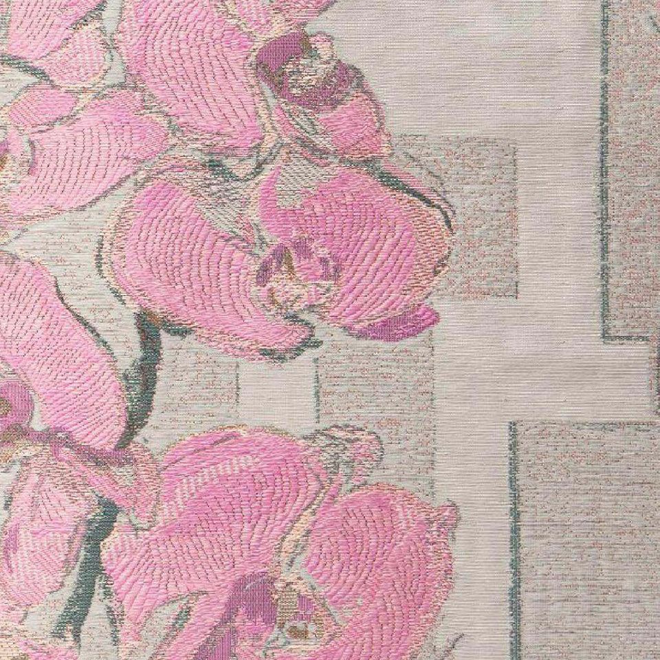 胡蝶蘭の花と幾何学模様とのモダンな構成柄の「バッラーレ」は、緯糸を刺繍のように織り込み、蘭の花の持つ気品と高級感を表現しました