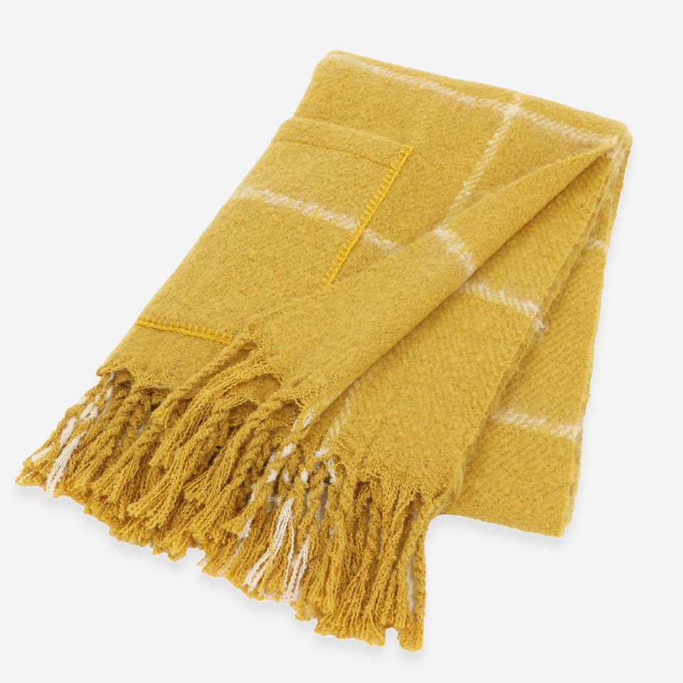 ポケット付き、太めのフリンジがアクセントになっています／カラー：イエロー