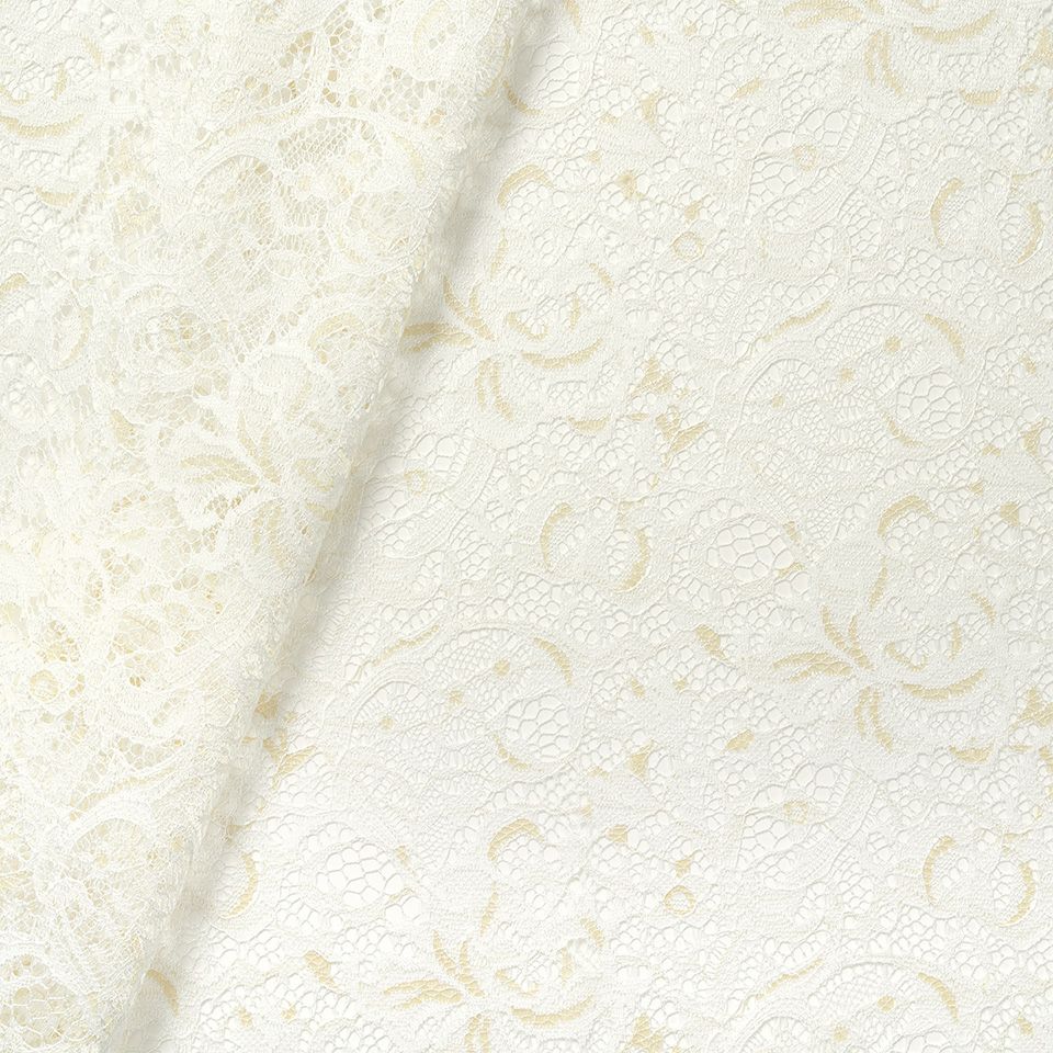 生地拡大画像／ベージュ色の糸をポイント色として使うことで、編み表現に奥行を持たせています